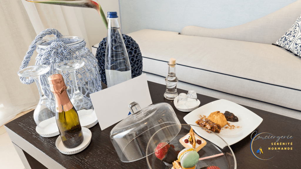 💡 Comment valoriser son logement en location courte durée – 7 astuces puissantes et faciles 8 Table basse avec champagne, macarons, eau, snacks et carte de bienvenue.